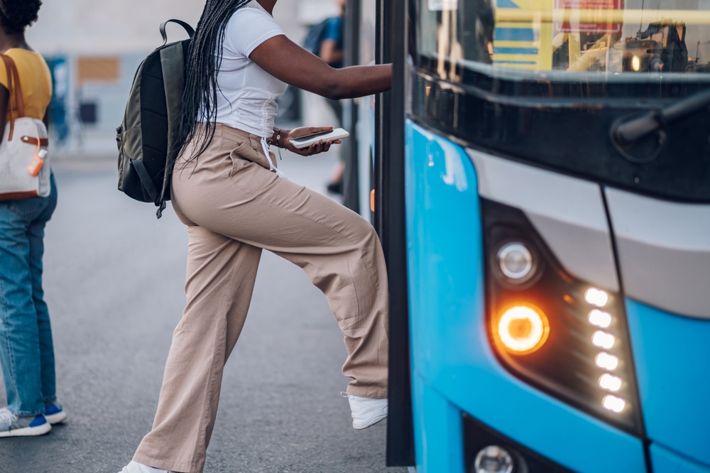Person getting on a bus
